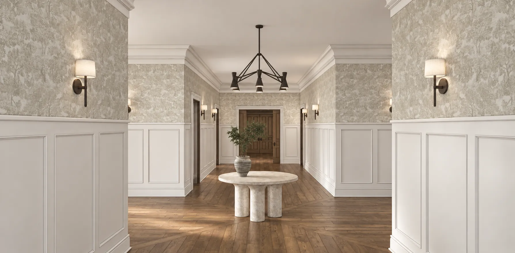 Entry hall of the Woodstown Residence, reached from the first floor plan: wainscoting, a botanical wallcovering, a sculptural round table and an iron chandelier